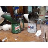 Two metal Castrol oil and Mobil oil cans. {20 cm H x 28 cm W}.