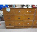 Early 20th C. scumbled pine bank of nine shop drawers with original metal handles. {113 cm H x 145