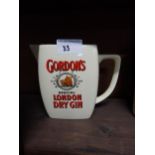 Gordon's London Dry Gin ceramic advertising jug. {13 cm H x 17 cm W x 9 cm D}.