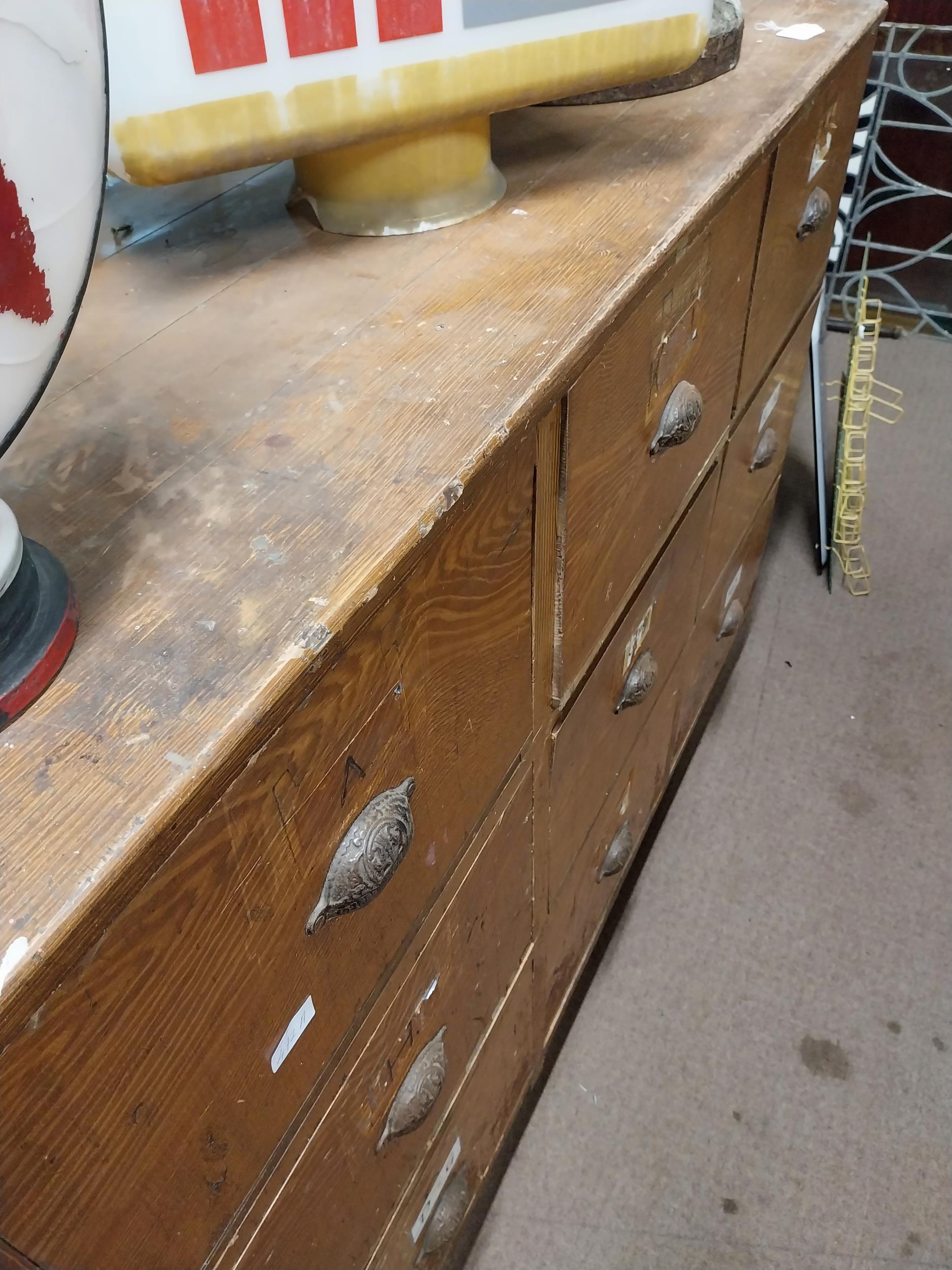 Early 20th C. scumbled pine bank of nine shop drawers with original metal handles. {113 cm H x 145 - Image 2 of 4