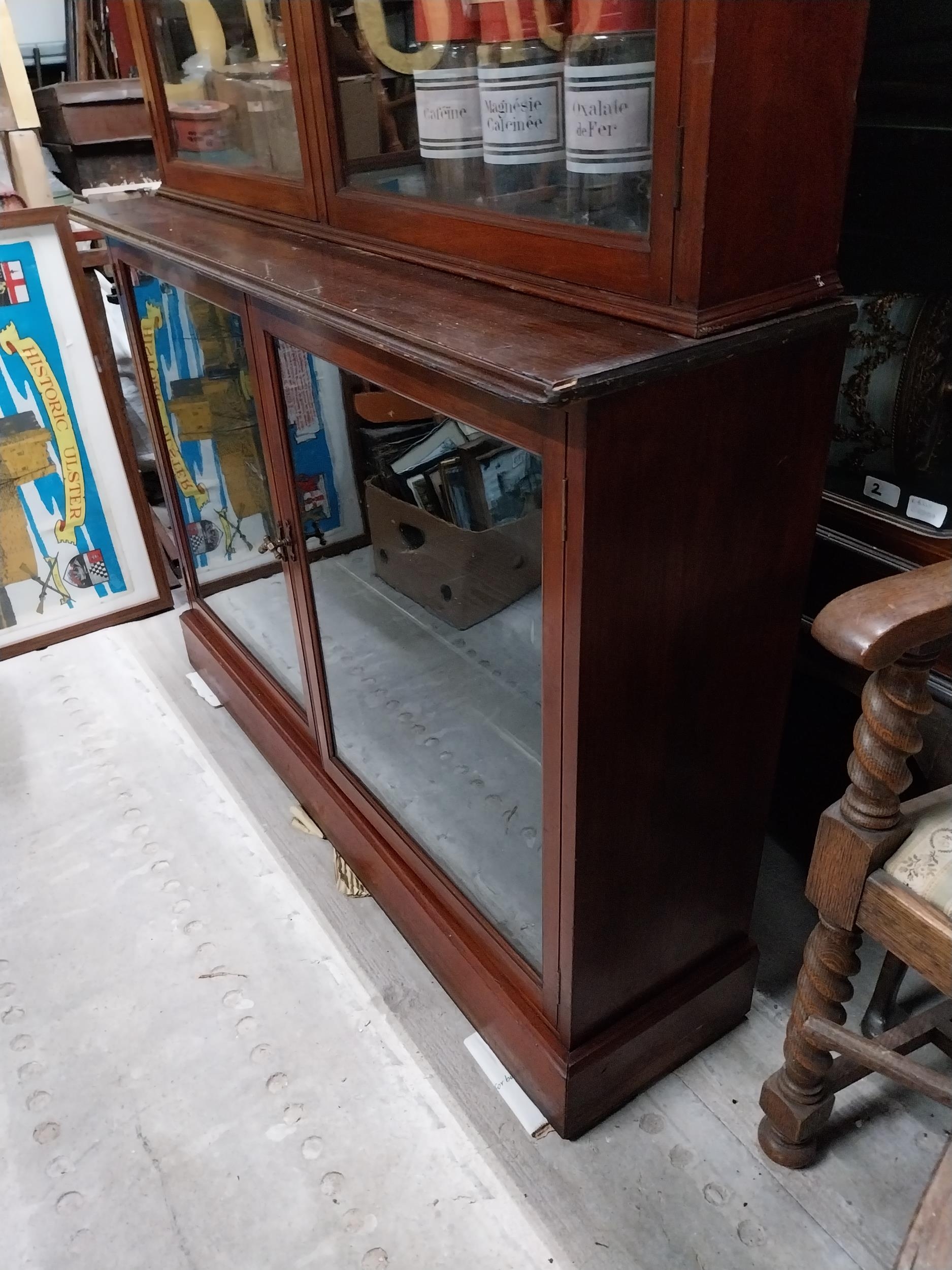 Early 20th mahogany shop display cabinet with two glazed doors over two glazed doors. {217 cm H x - Image 3 of 3