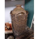 William Cowan Belfast stoneware flagon in original basket. {49 cm H x 28 cm Diam}.