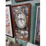 Guinness advertising clock in mahogany frame with mirrored glass. {54 cm H x 29 cm W x 9 cm D}.