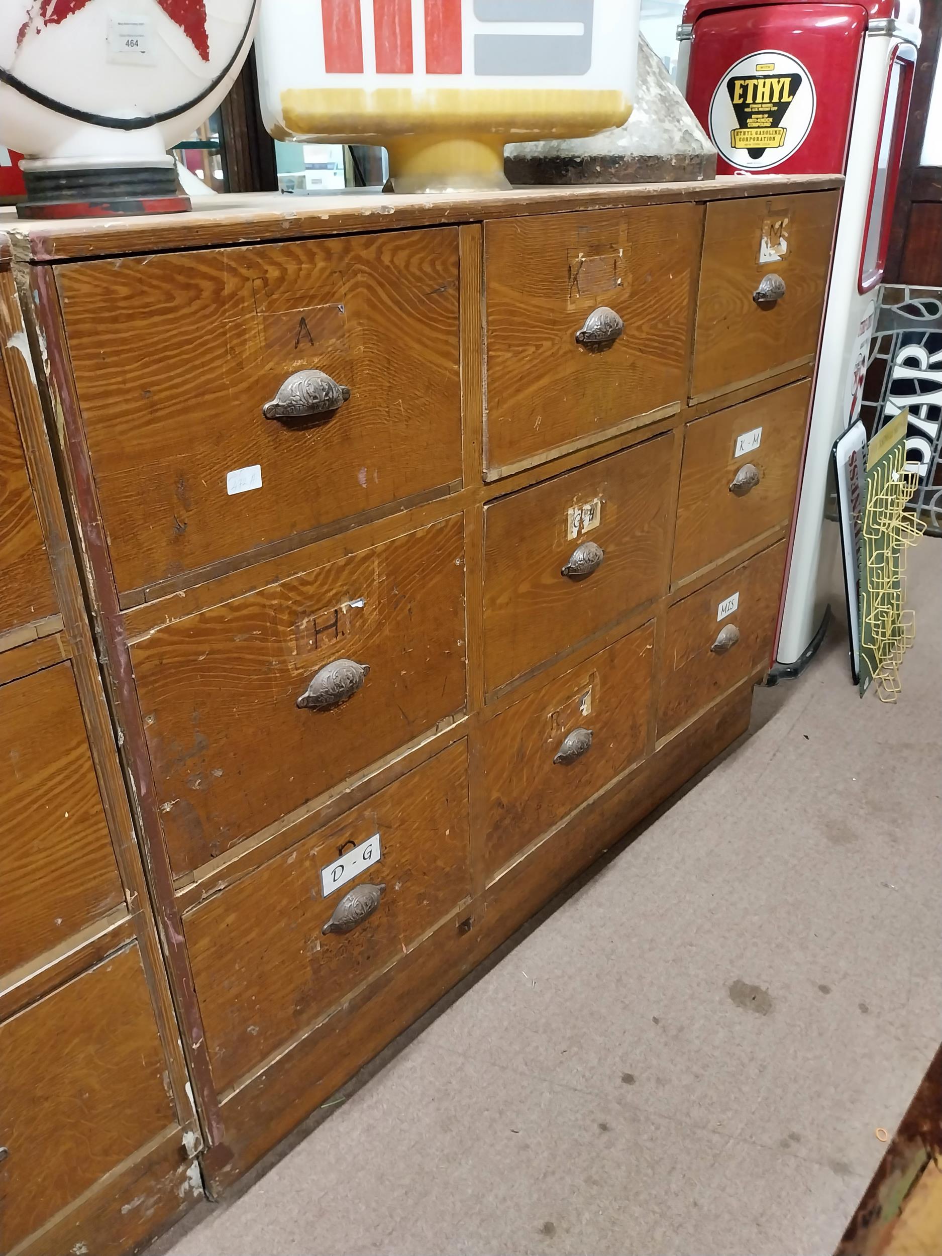 Early 20th C. scumbled pine bank of nine shop drawers with original metal handles. {113 cm H x 145