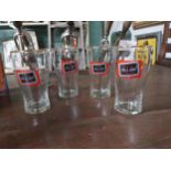 Four Carling Black Label glasses {13 cm H x 7 cm Diam}.