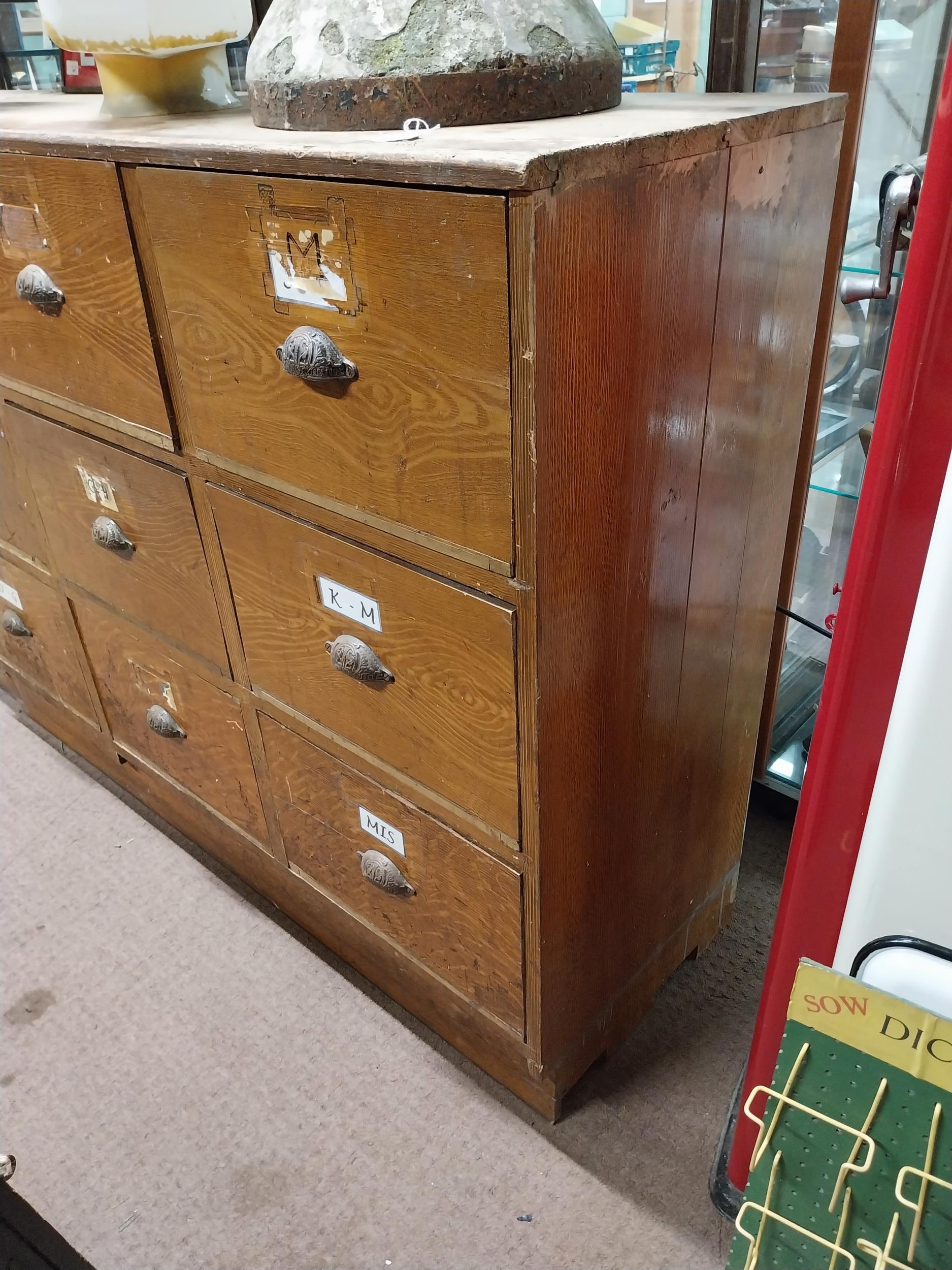 Early 20th C. scumbled pine bank of nine shop drawers with original metal handles. {113 cm H x 145 - Image 4 of 4