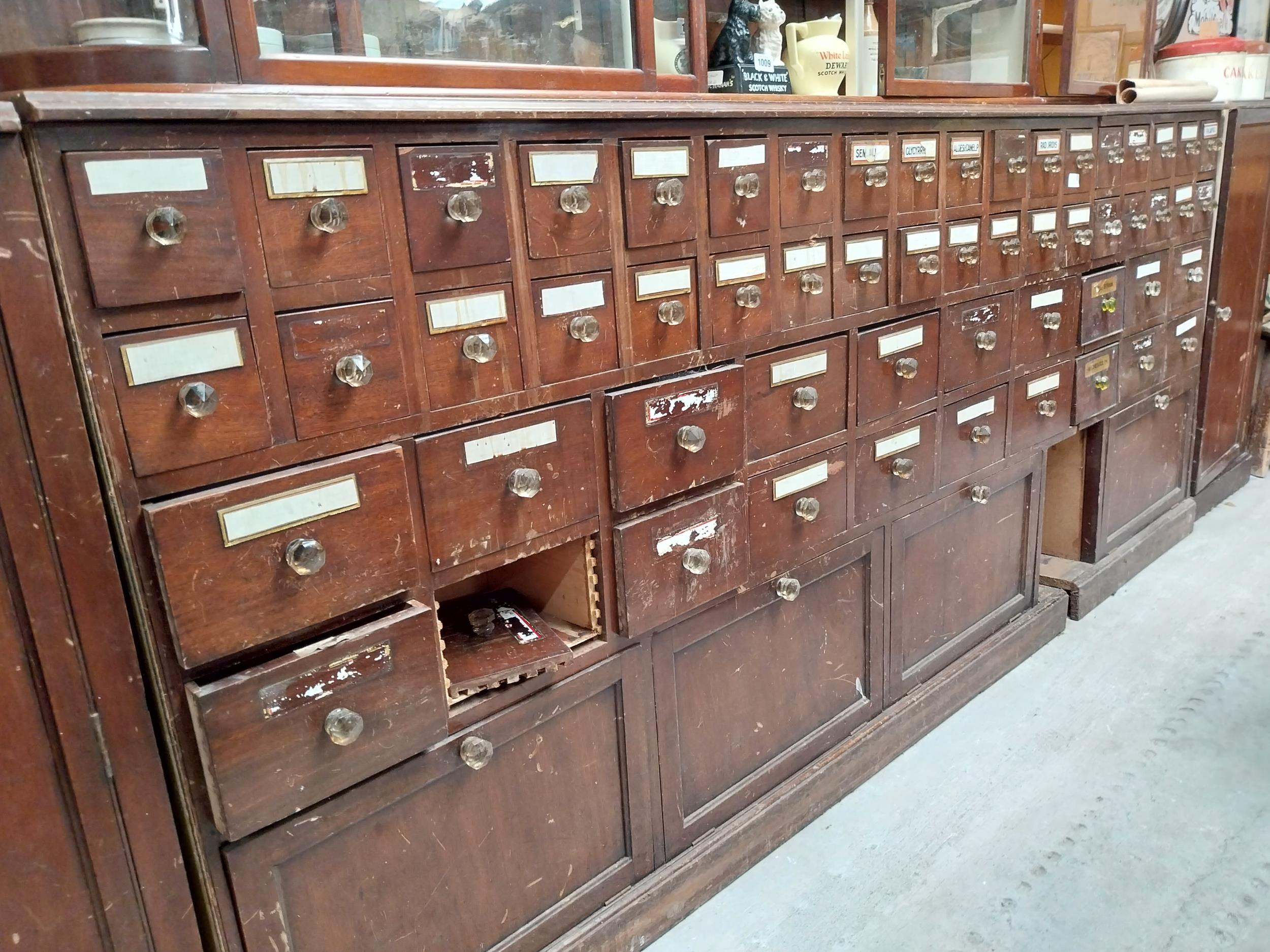 Early 20th C mahogany bank of sixty chemist drawers with original glass handles flanked by two - Image 2 of 3