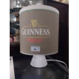 Ceramic Guinness advertising lamp with original shade. {28 cm H x 22 cm Diam}.