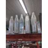 Collection of five Esso oil bottles. {34 cm H x 8 cm Diam}.