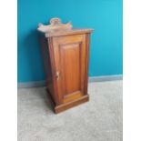 Edwardian mahogany bedside locker with single door raised on platform base.