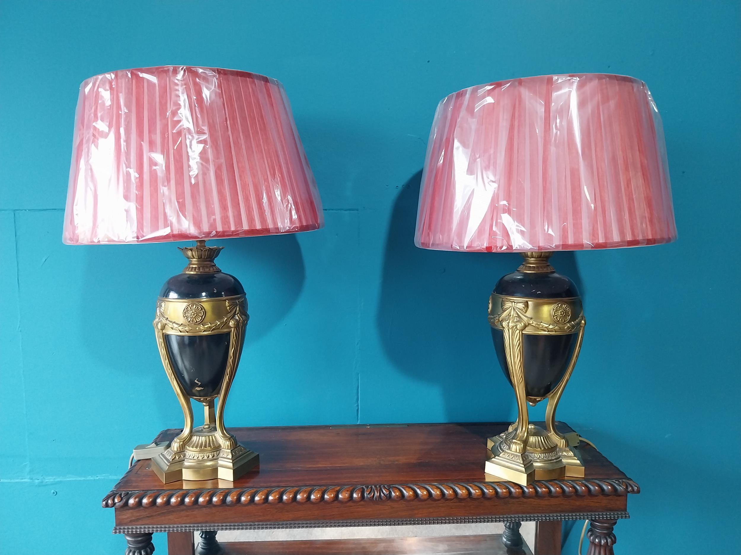 Pair of gilded metal table lamps with cloth shades in the Empire style {67 cm H x 42 cm Dia.}.