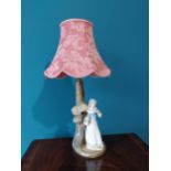 Decorative hand painted ceramic table lamp depicting the flower seller {59cm H x 32cm W x 30cm D}