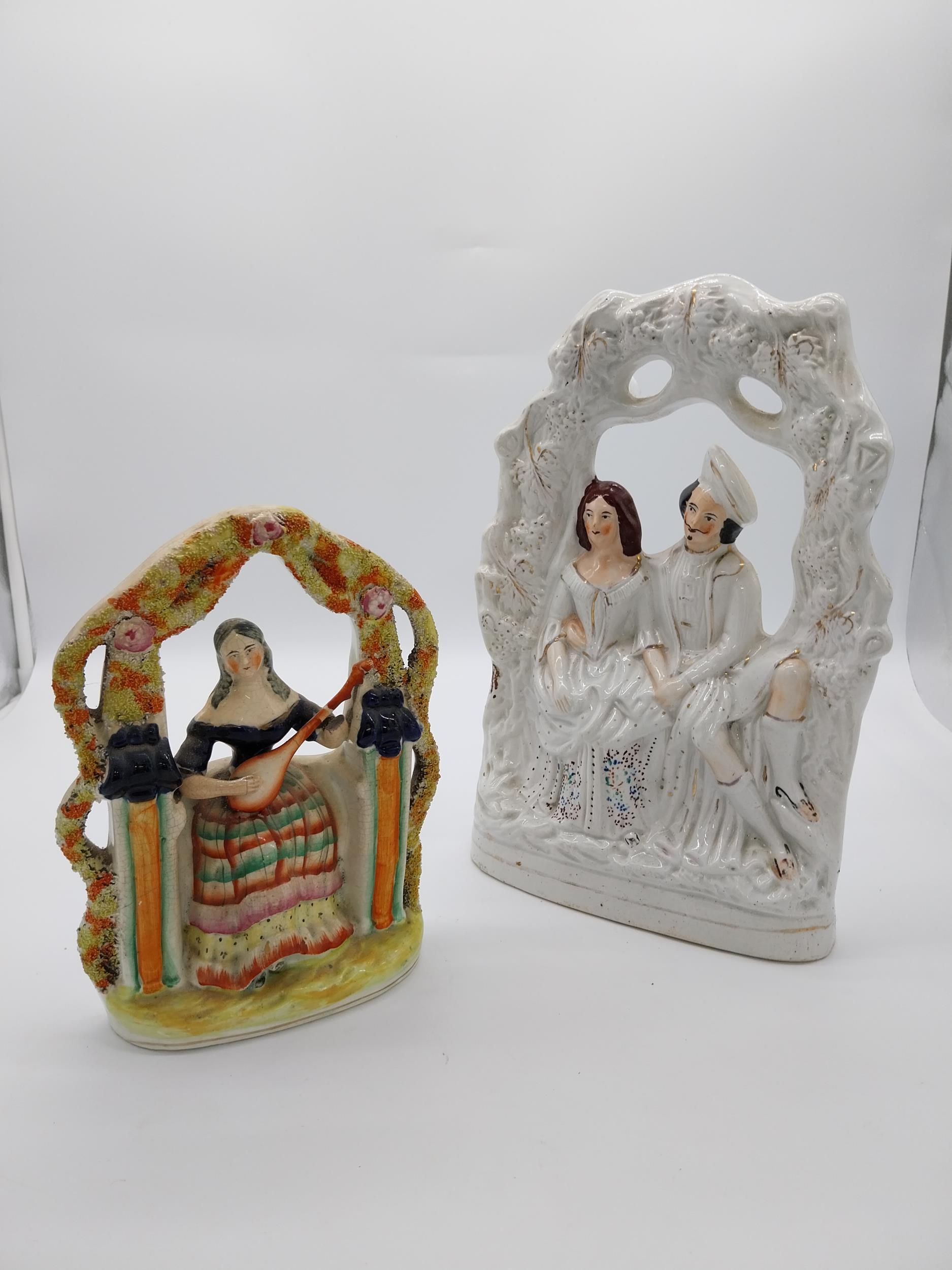 Two 19th C. Staffordshire figurines {36 cm H x 24 cm W x 10 and 25 cm H x 18 cm W x 9 cm D}.