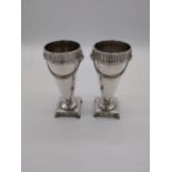 Pair of English silver rose bud vases decorated with swags and lion's mask heads. Hallmarked in