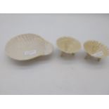 Pair of modern Belleek Limpet Shell salts { one damaged } & Shell dessert dish all with green