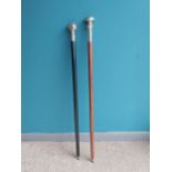 Pair of silverplated topped walking sticks {97 cm L}.