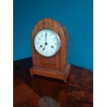 Edwardian mahogany and satinwood inlaid arched top bracket clock with enamel dial {30 cm H x 22 cm W