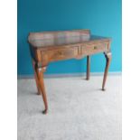 Early 20th C. mahogany side table with gallery back and two drawers in the frieze raised on cabriole