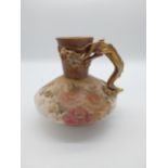 19th C. hand painted ceramic jug decorated with a dragon in the Oriental style {19 cm H x 20 cm
