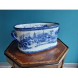Decorative blue and white ceramic foot bath {20 cm H x 50 cm W x 31 cm D}.