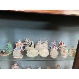 Collection of eleven ceramic Dresden figurines.