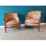 Good quality pair of His and Hers French Edwardian carved walnut and crushed velvet armchairs raised