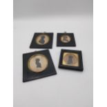 Collection of four 19th C. silhouettes mounted in ebonised frames {Largest 15 cm H x 13 cm W and