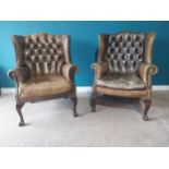 Pair of exceptional quality early 20th C. hand dyed leather deep button wingback armchairs on