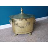 Good quality 19th Brass lidded coal bucket decorated with lions masks raised on lion paw feet {