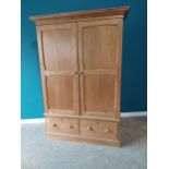 19th C. stripped pine two door wardrobe with two panel doors above two short drawers and fitted