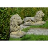 Pair of stone recumbent lions . {55cm H x 80cm W x 30cm D}