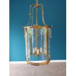 Good quality French gilded brass circular hall lantern decorated with swags and with glass panels {