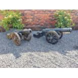 Pair of good quality cast iron models of Cannons {60 cm H x 151 cm W x 60 cm D}.
