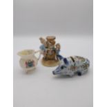 Ceramic piggy bank, ceramic figure of a boy and girl and second Period Belleek jug. {7 cm H x 15
