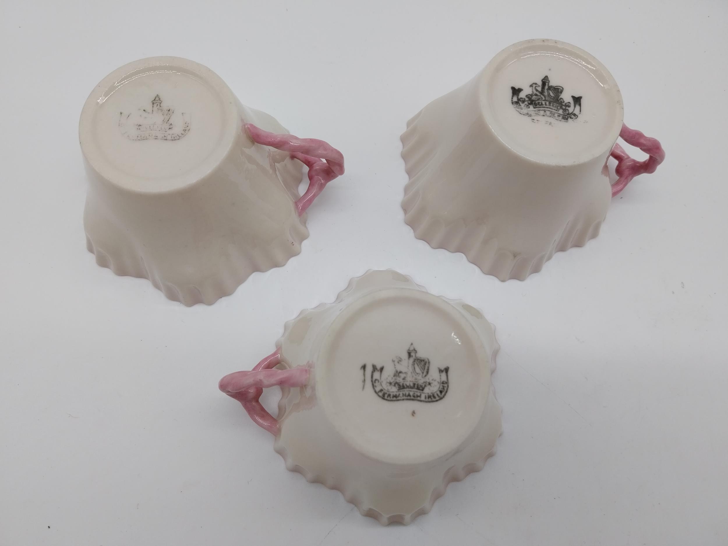 Three second period Belleek black stamp tea cups. { 6cm H X 10cm W X 9cm D }. - Image 3 of 3