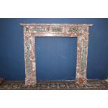 Red and white marble fireplace with black rectangle and black squares {H 134cm x W 153cmx D 32cm