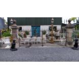 Pair of exceptional quality hand cut limestone gate pillars and pair of wrought iron entrance gates