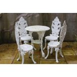 Cast iron garden table with four fern leaf back garden chairs {Table H 70cm x Dia 60cm, Chairs H