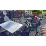 Pair of cast iron garden arm chairs with wooden slats seats {74 cm H x 66 cm W x 68 cm D}.