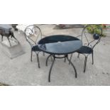 Wrought iron garden table with inset glass top and two matching chairs {73 cm H x 80 cm Dia 90 cm