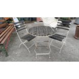 Wrought iron and wooden folding garden table with two matching chairs {Table 77 cm H x 70 cm Dia -