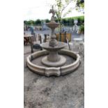 Good quality moulded stone two tiered fountain surmounted with Cherub including surround {Overall