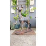 Good quality cast iron Stag raised on platform base {145 cm H x 110 cm W x 45 cm D}.