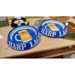 Two tin plate Harp Lager advertising ashtrays. {3 cm H x 20 cm Dia.}.