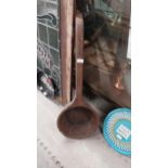 19th C. African wooden ladle initialled NP. {12 cm H x 91 cm W x 31 cm D}.