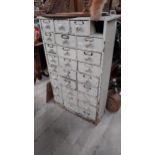 Early 20th C. painted pine bank of twenty seven drawers. {117 cm H x 77 cm W x 26 cm D}.