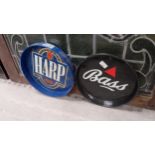 Two advertising trays - Bass {30cm Dia.} and Harp. {33cm Dia.} and Tennent's mat .