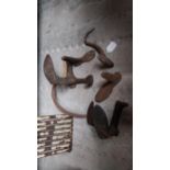 Collection of shoe lasts, sickle and bale hook.
