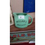 Millar's Wines, Cordials and Whiskies ceramic advertising water jug {11 cm H x 14 cm W x 10 cm D}.