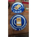 Two Harp Lager tin plate ashtrays. {20 cm Dia.}.